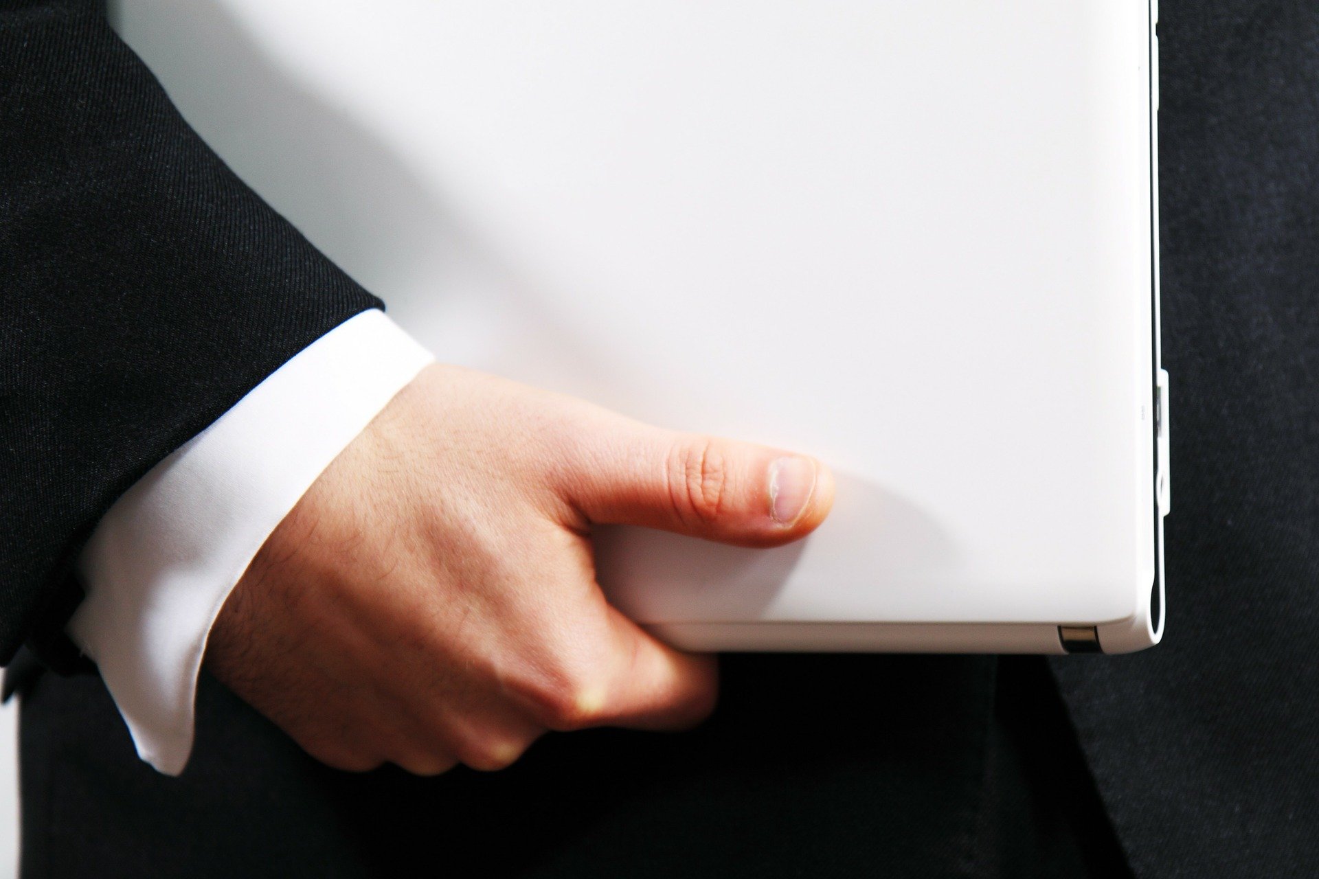 Businessman holding laptop